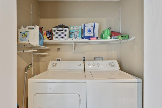 washroom with washing machine and clothes dryer