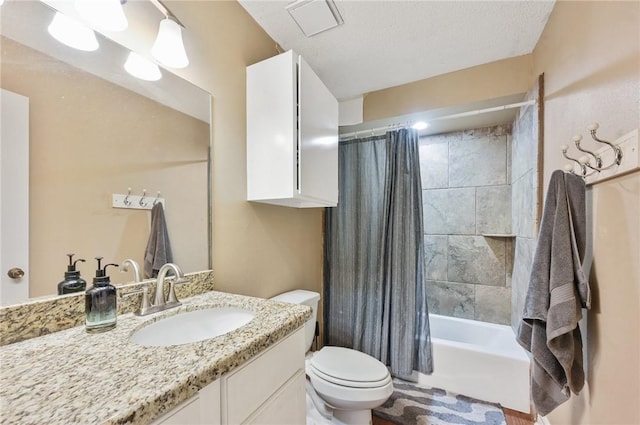 full bathroom featuring vanity, toilet, shower / bathtub combination with curtain, and a textured ceiling