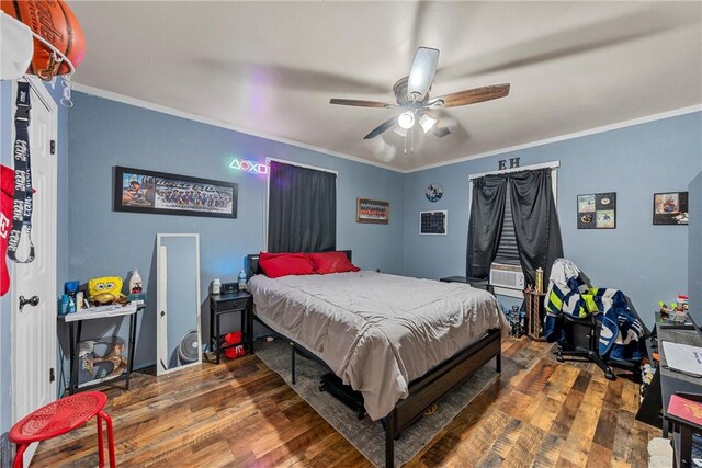 117 S Judge Hailey Dr, Lott, TX 76656 - bedroom featuring wood finished floors, ceiling fan, and ornamental molding