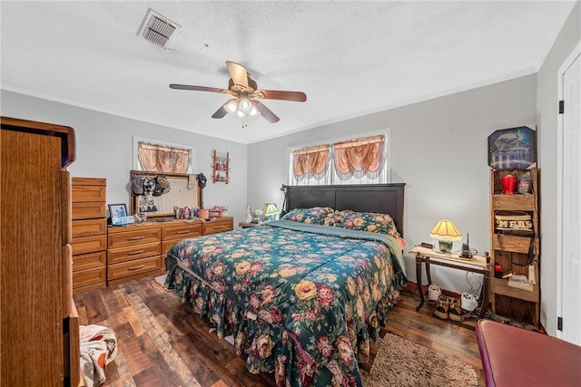 117 S Judge Hailey Dr, Lott, TX 76656 - bedroom with a ceiling fan, visible vents, and hardwood / wood-style flooring