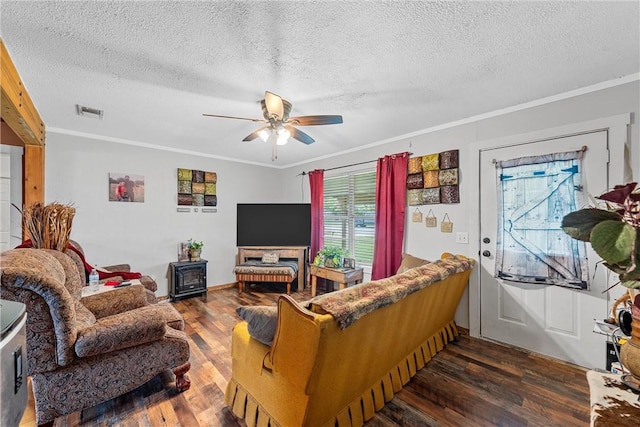117 S Judge Hailey Dr, Lott, TX 76656 - living area featuring wood finished floors, ceiling fan, and a textured ceiling