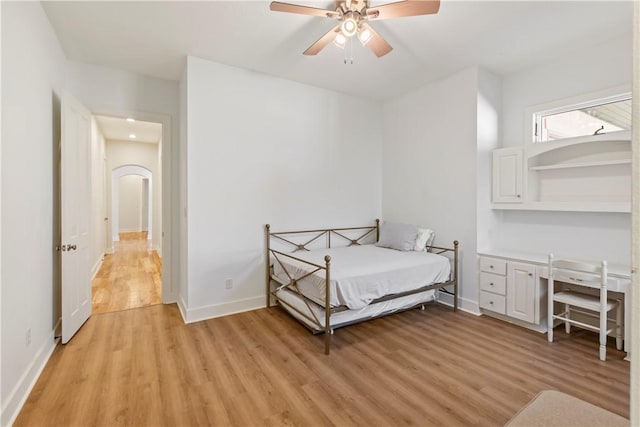 bedroom with light hardwood / wood-style flooring and ceiling fan