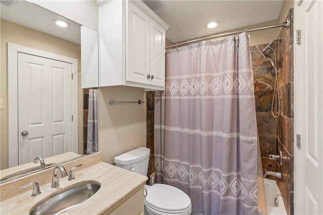 full bathroom featuring vanity, toilet, and shower / tub combo with curtain