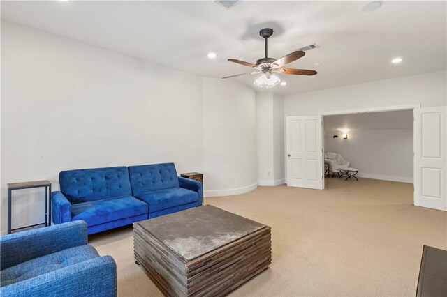 living room with ceiling fan and light carpet