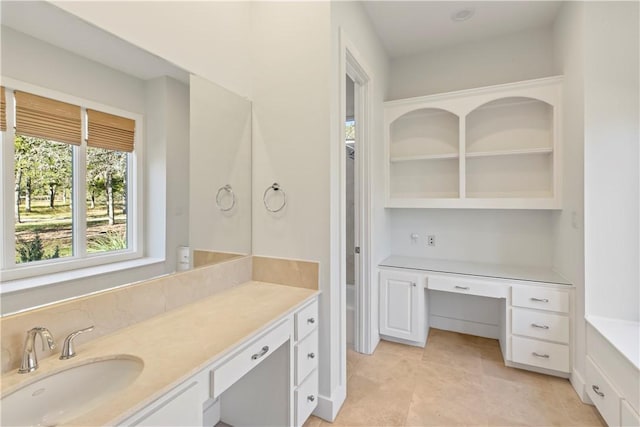 bathroom with tile patterned flooring and vanity