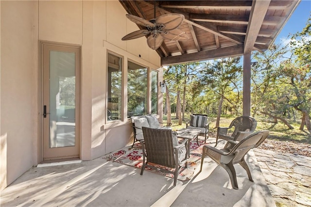 view of patio / terrace featuring ceiling fan and an outdoor living space