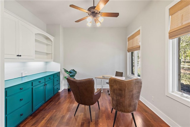 dining room featuring dark hardwood / wood-style floors, a wealth of natural light, and ceiling fan