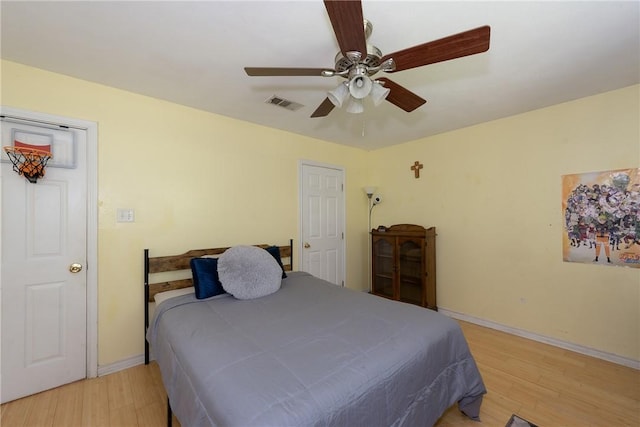 bedroom featuring ceiling fan and light hardwood / wood-style flooring