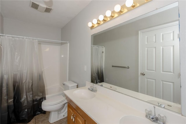 full bathroom with tile patterned floors, vanity, toilet, and shower / bath combo with shower curtain