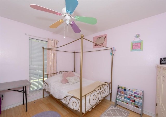 bedroom featuring light hardwood / wood-style floors and ceiling fan