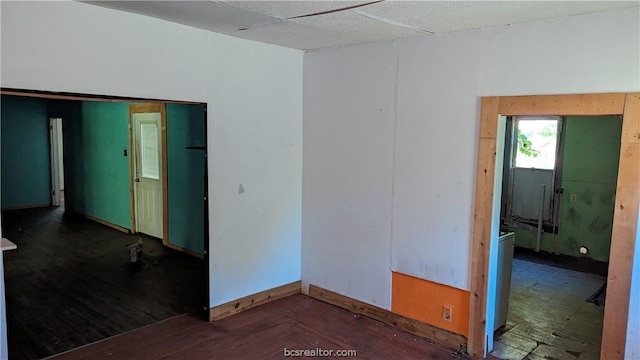 empty room featuring dark wood-type flooring