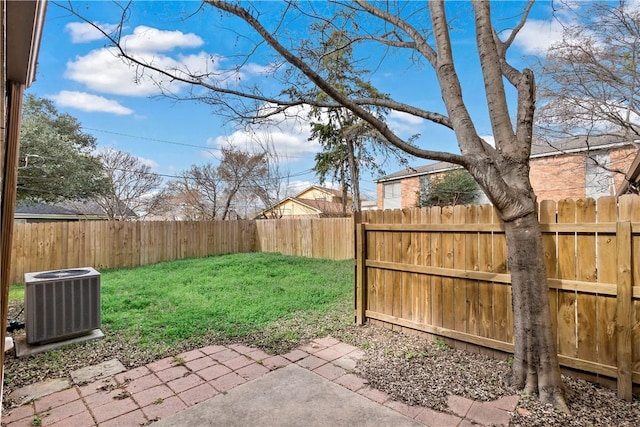 view of yard featuring a patio and central air condition unit