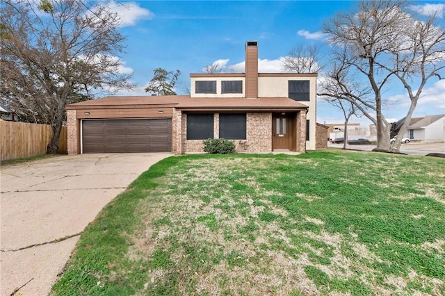 view of front of home featuring a garage and a front yard