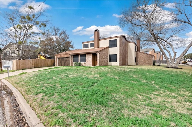 rear view of house featuring a lawn