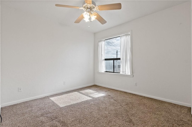 spare room with carpet floors and ceiling fan