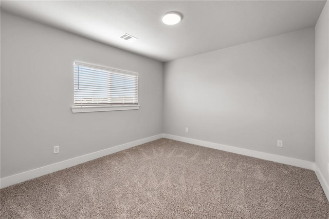 unfurnished room featuring carpet floors