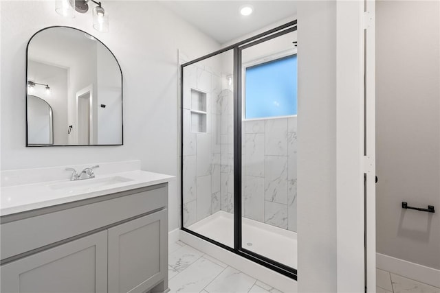 bathroom featuring vanity and an enclosed shower