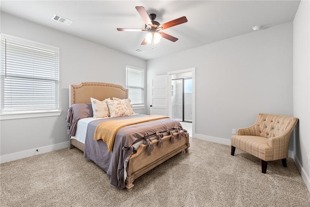 carpeted bedroom featuring multiple windows and ceiling fan