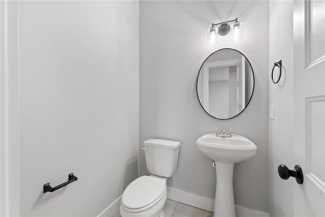 bathroom featuring tile patterned flooring and toilet