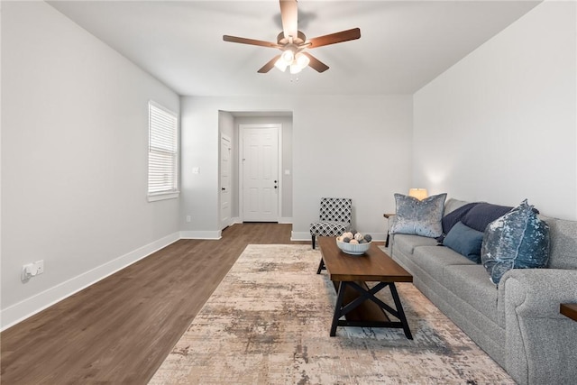 living room with ceiling fan and dark hardwood / wood-style floors