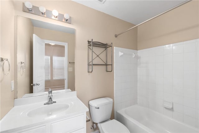 full bathroom featuring vanity, toilet, and tiled shower / bath combo