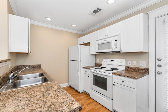 kitchen featuring white appliances, white cabinets, sink, ornamental molding, and light hardwood / wood-style floors