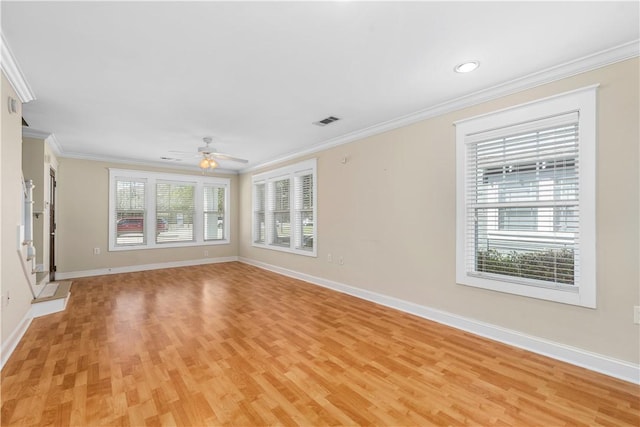 unfurnished room featuring light hardwood / wood-style floors, crown molding, ceiling fan, and a healthy amount of sunlight