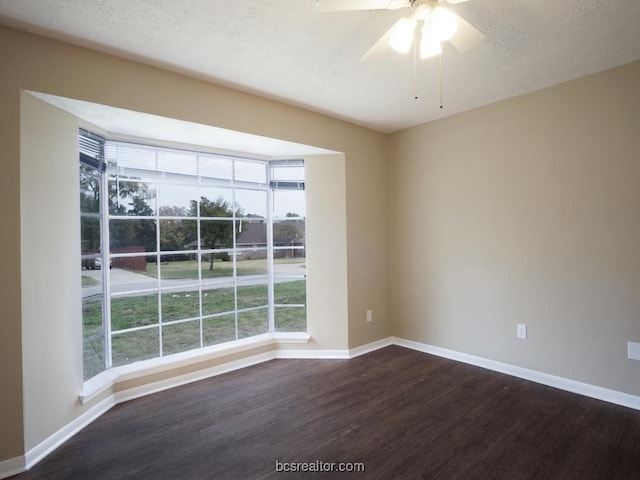 spare room with hardwood / wood-style floors, ceiling fan, and a textured ceiling