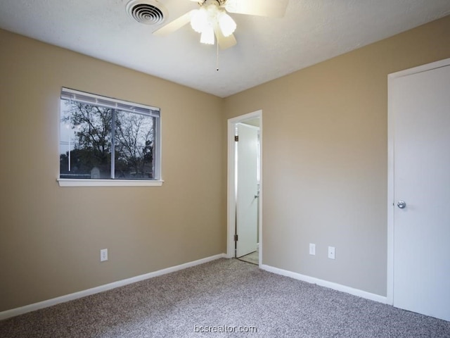 unfurnished bedroom featuring carpet and ceiling fan