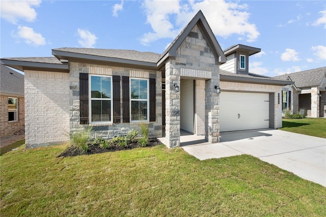 view of front of home with a garage, a front yard, stone siding, and driveway