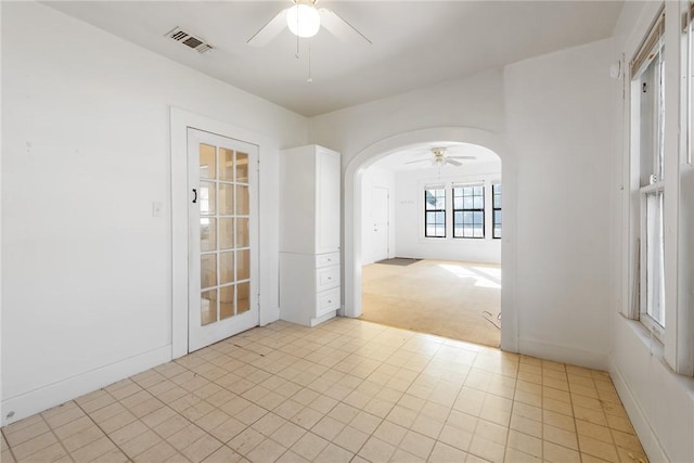 empty room with light carpet and ceiling fan