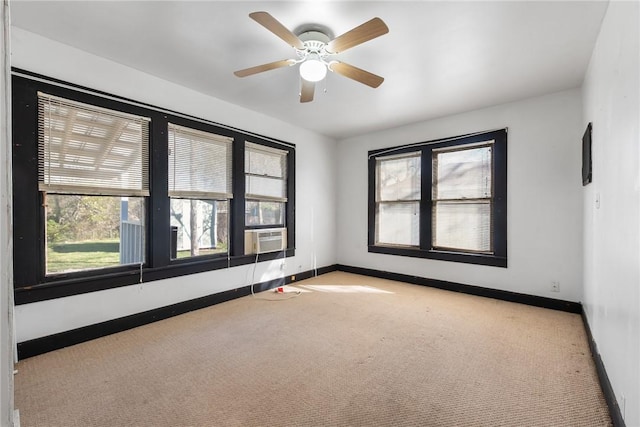 empty room with light colored carpet and ceiling fan