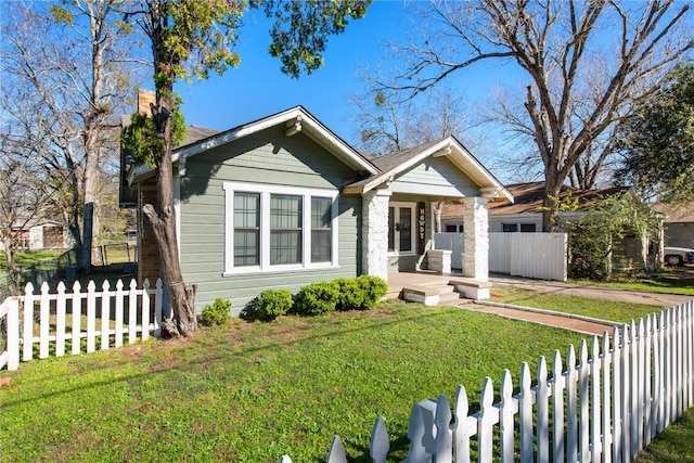 bungalow-style home featuring a porch and a front lawn