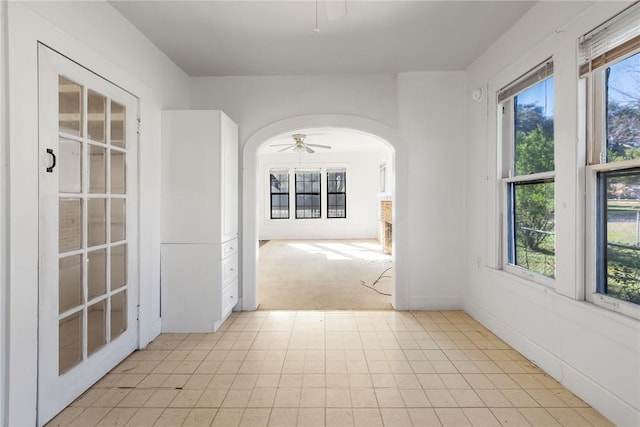 hallway with light colored carpet