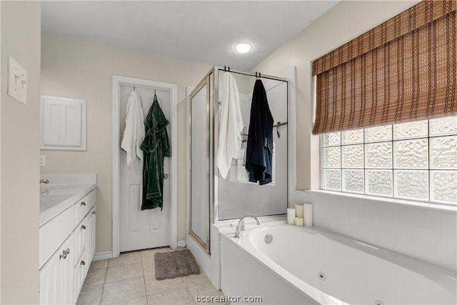 bathroom featuring tile patterned floors, vanity, and independent shower and bath