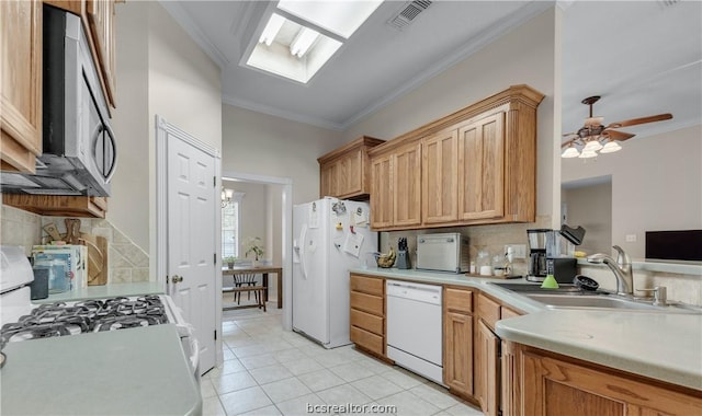 kitchen featuring sink, white appliances, backsplash, and ornamental molding