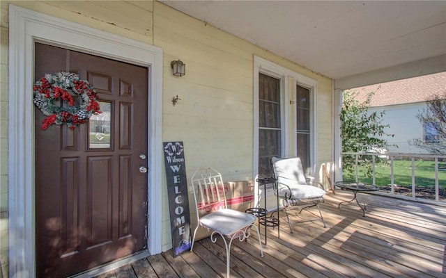 entrance to property featuring covered porch