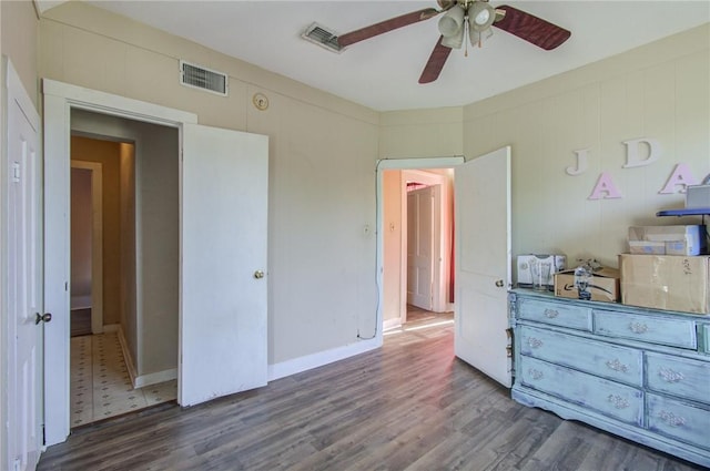 bedroom featuring dark hardwood / wood-style floors and ceiling fan