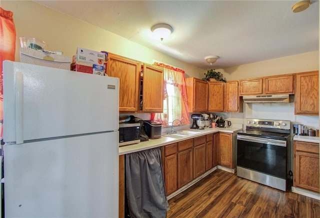 kitchen featuring dark hardwood / wood-style flooring, sink, and appliances with stainless steel finishes