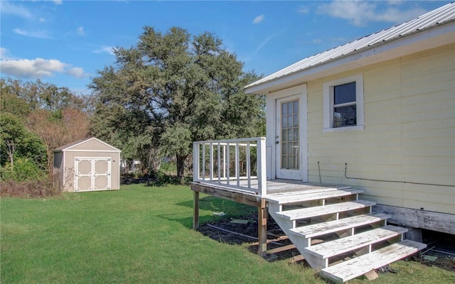 view of yard with a wooden deck and a shed