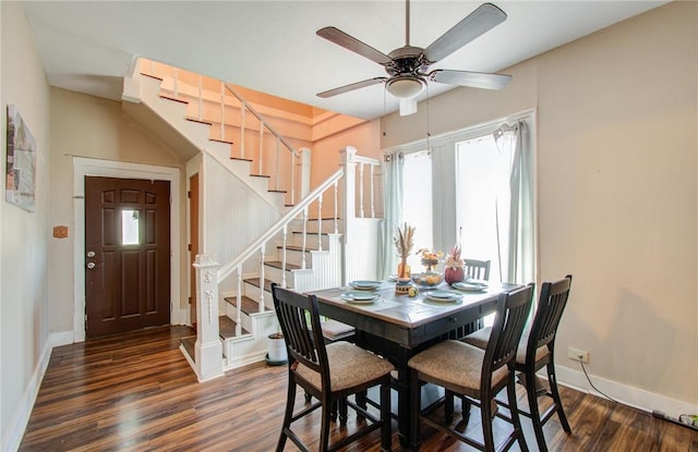 dining room with ceiling fan and dark hardwood / wood-style floors