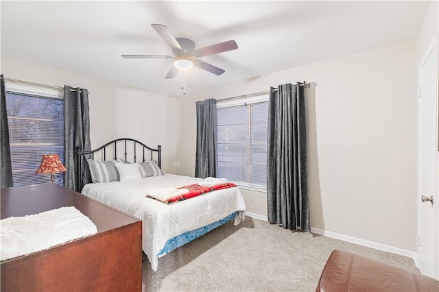 bedroom with carpet, a ceiling fan, and baseboards