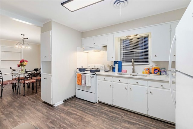 kitchen featuring white appliances, dark wood-style floors, light countertops, under cabinet range hood, and a sink