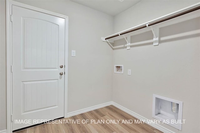 1147 Canton Dr, College Station, TX 77845 - laundry area featuring washer hookup, wood finished floors, and baseboards