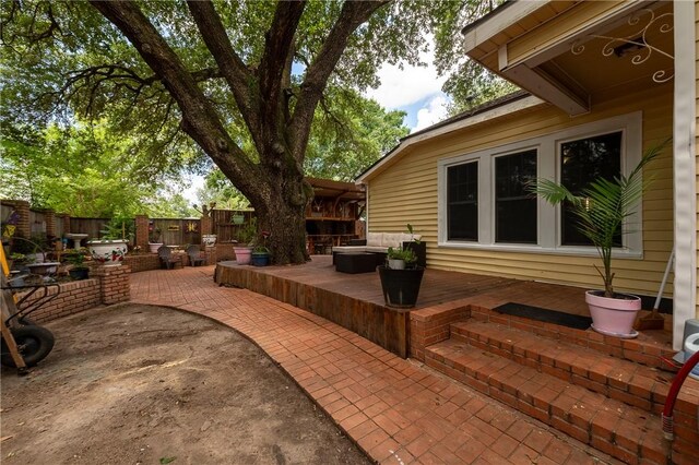 1004 S Magnolia St, Hearne, TX 77859 - full bath with tile walls, tile patterned floors, a shower with door, and tasteful backsplash