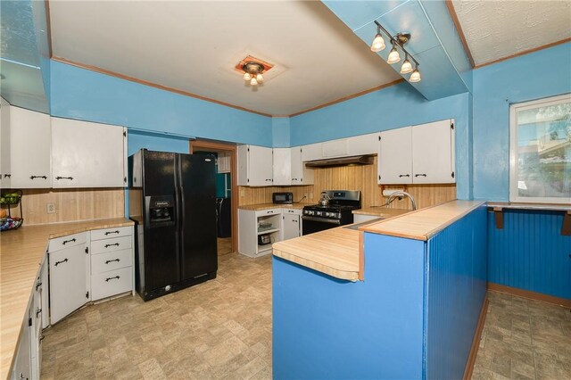 1004 S Magnolia St, Hearne, TX 77859 - empty room featuring wood-type flooring, brick wall, and a ceiling fan