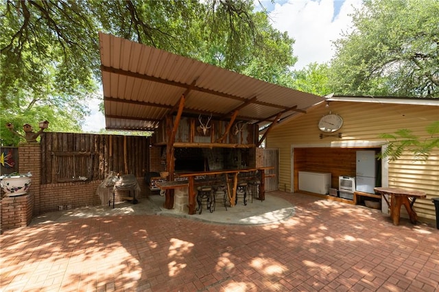 1004 S Magnolia St, Hearne, TX 77859 - view of patio / terrace featuring a garage