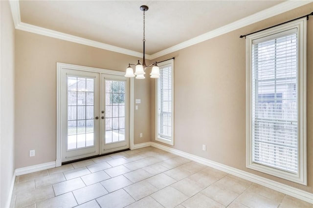 spare room with a chandelier, baseboards, and ornamental molding