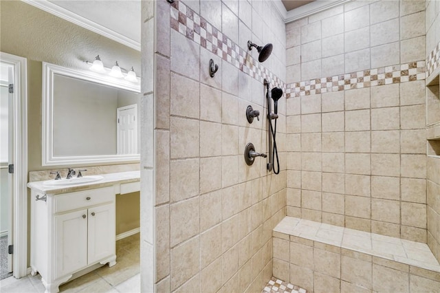 full bath with vanity, crown molding, and a tile shower