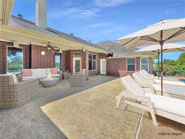 exterior space featuring outdoor lounge area, a patio, and ceiling fan